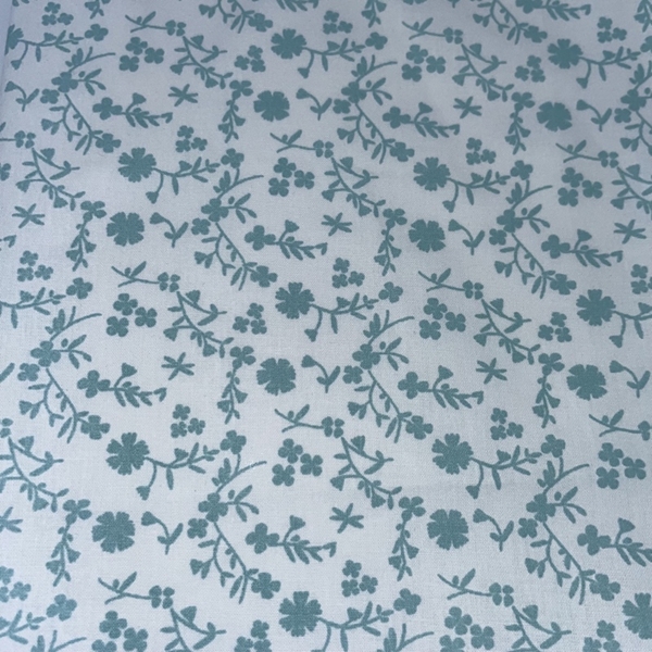 COUPON 75X35CM FLEURS TURQUOISE FOND BLANC