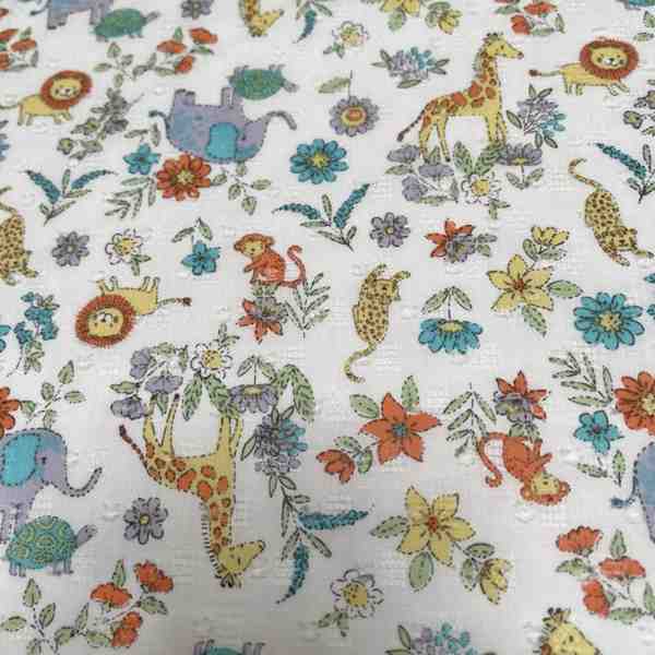 TISSU COTON PLUMETIS LES ANIMAUX ET FLEURS COLORES