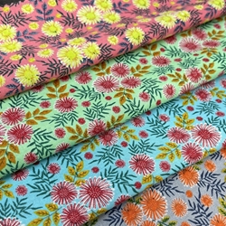 TISSU COTON FLEURETTE ORANGE FOND GRIS