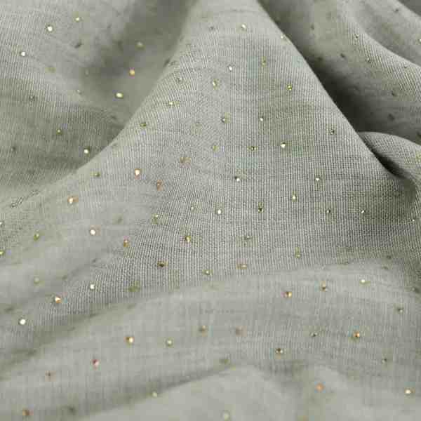 TISSU POLYESTER VERT À STRASS DORÉS